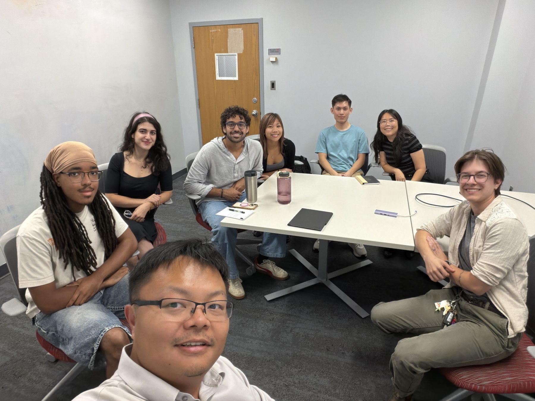 The Zhang Lab around a table at a group study meeting, September 14, 2026